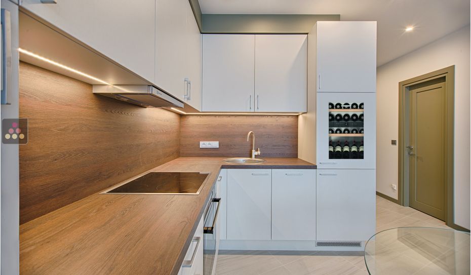 Multi-purpose built in wine cabinet for the storage and service of wine
