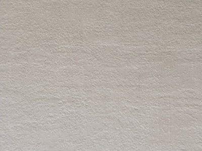 Flat door frame covered with a Dove-grey concrete finish laminate