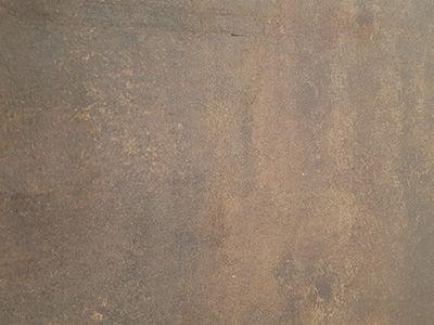 Wooden cladding covered with a Corten finish laminate