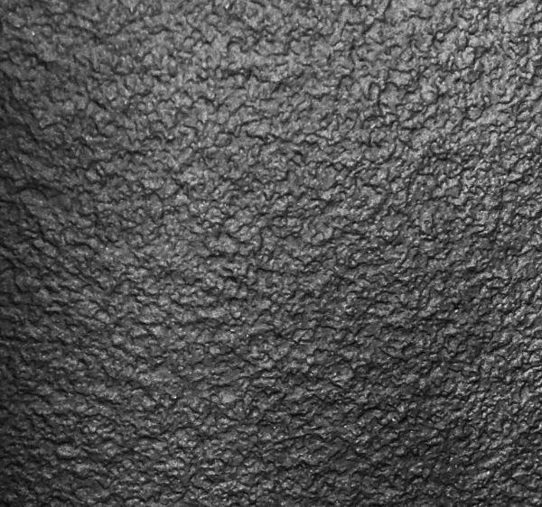 Wooden cladding covered with a textured Black finish laminate